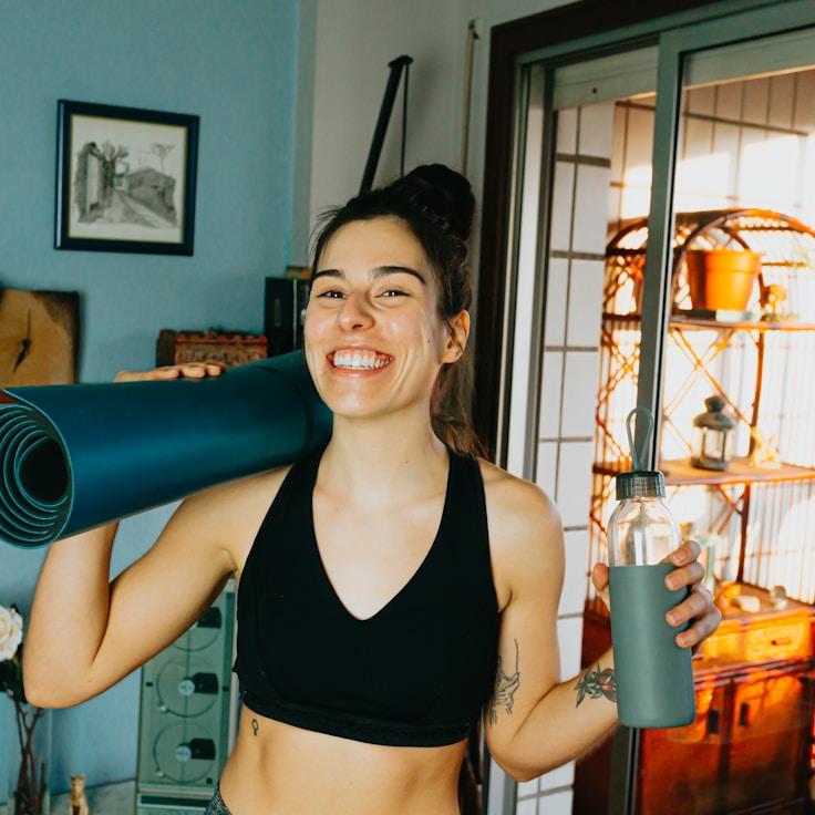 Women in a fitness class doing stretching and mobility exercises
